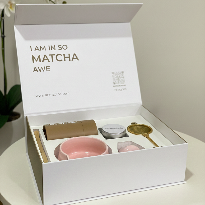Matcha tea set in a white box with 'I AM IN SO MATCHA AWE' text on a light background.